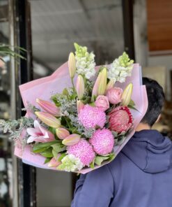 Man Carrying the Brings A Smile Bouquet