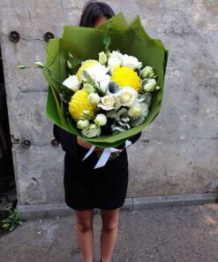 Woman Holding A Bouquet of Flowers